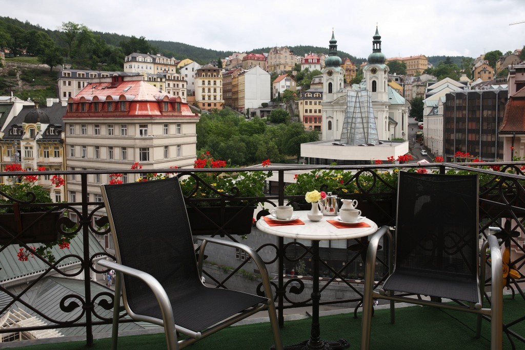 Enjoy coffee or tea on the balcony in the De Luxe Balcony Room
